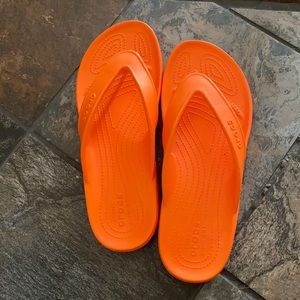 Men’s orange crocs flip flops